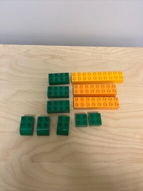Bulk lot of LEGO DUPLO pieces, 11 pieces of various sizes and colors